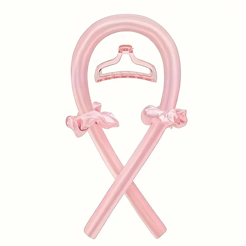 Pink plastic hair dryer holder stand featuring decorative bow accents, crossed support arms, and a clear hanging attachment, displayed on a white background.